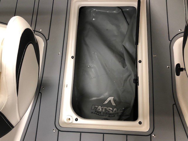 Glass fibers either loose or woven, reinforced with resin and used in the construction of many boats.