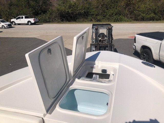 Glass fibers either loose or woven, reinforced with resin and used in the construction of many boats.