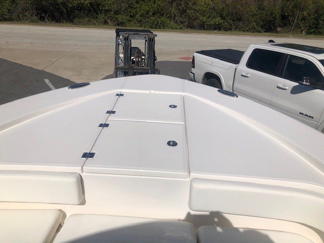 The definition of an outboard motor is a detachable engine mounted on outboard brackets on the stern of your boat.  This configuration will have only one single engine.