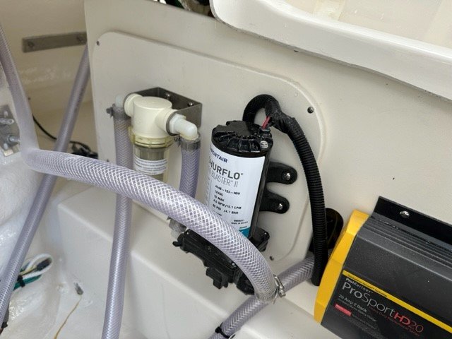 The definition of an outboard motor is a detachable engine mounted on outboard brackets on the stern of your boat.  This configuration will have only one single engine.