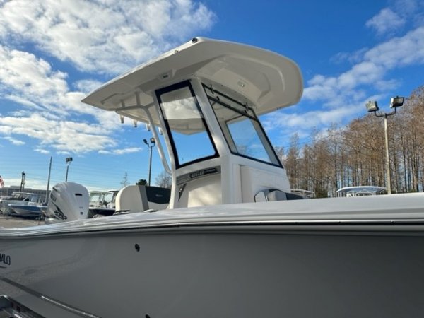 Glass fibers either loose or woven, reinforced with resin and used in the construction of many boats.