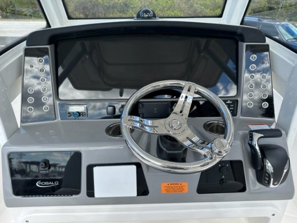 Glass fibers either loose or woven, reinforced with resin and used in the construction of many boats.