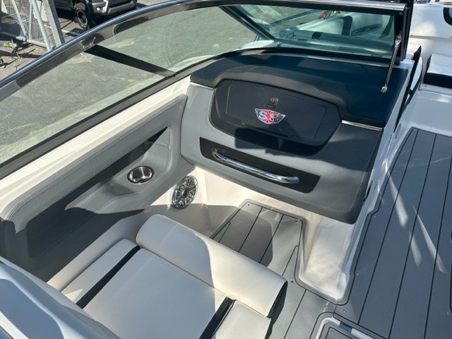 Zipping about on skis established a reference point for watery adventure. Truly hardy souls could push the envelope by ski-jumping a ramp or by not using skis at all - barefooting seemed to be the very edge of watersports world.