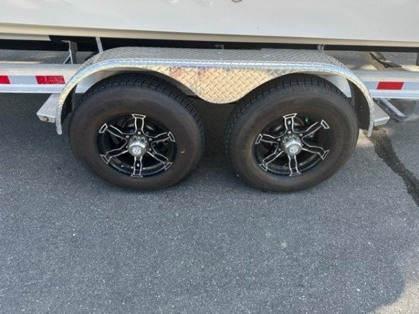 Glass fibers either loose or woven, reinforced with resin and used in the construction of many boats.