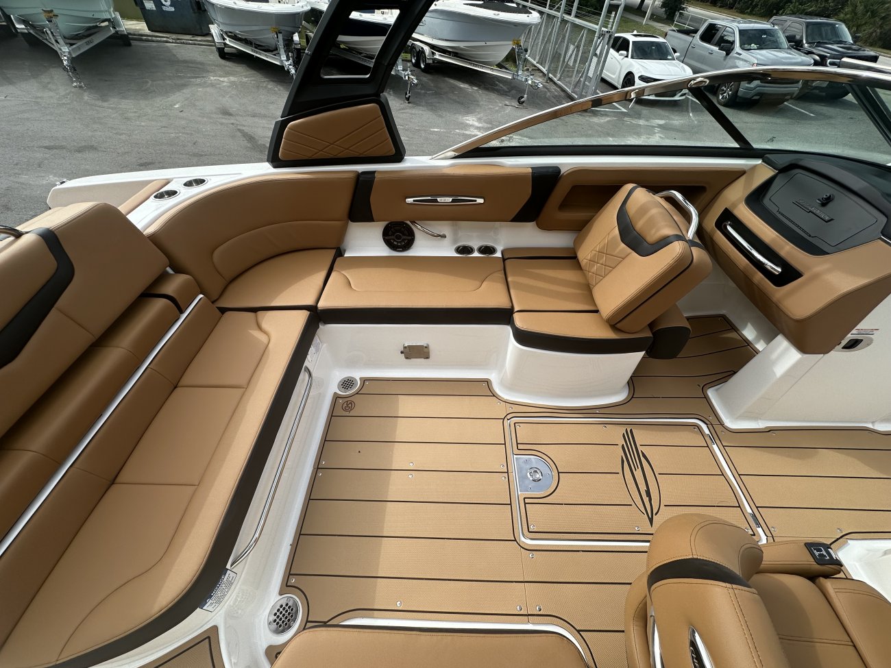 The deckboat is a cross between a bowrider and a pontoon boat.  It features a rather flat deck area with lots of room for people while still offering the speed and agility of a runabout.