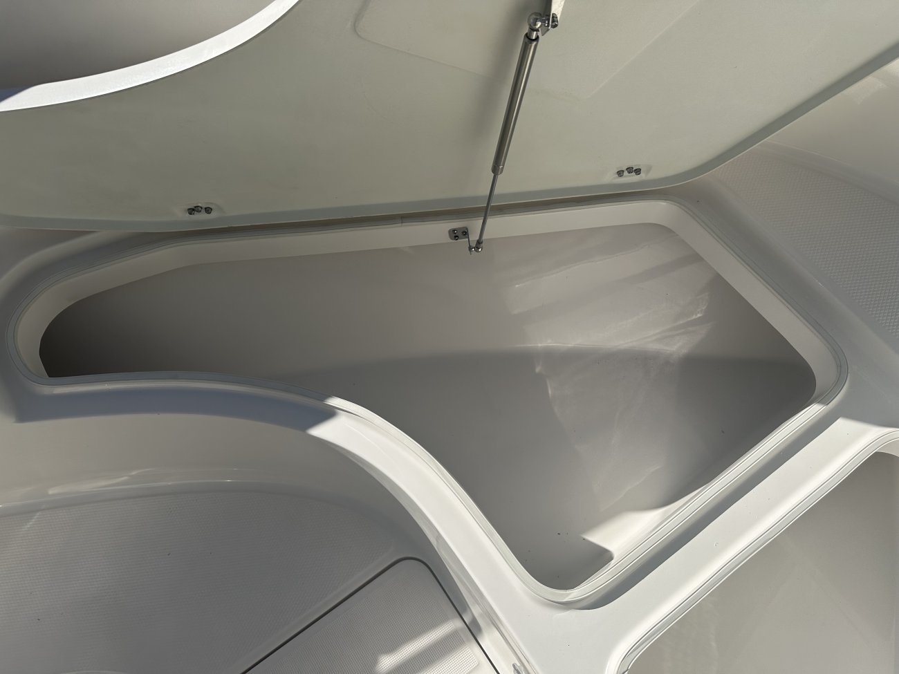 Center console is an open hull boat where the console of the boat is in the center. The boat deck surrounds the console so that a person can walk all around the boat from stern to bow with ease. Most center consoles are powered by outboard motors.