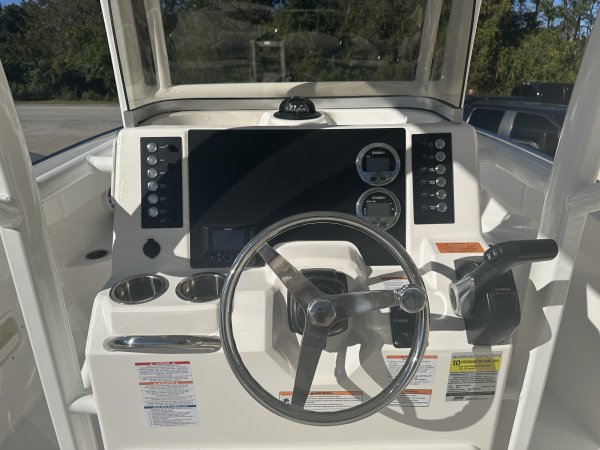 Center console is an open hull boat where the console of the boat is in the center. The boat deck surrounds the console so that a person can walk all around the boat from stern to bow with ease. Most center consoles are powered by outboard motors.