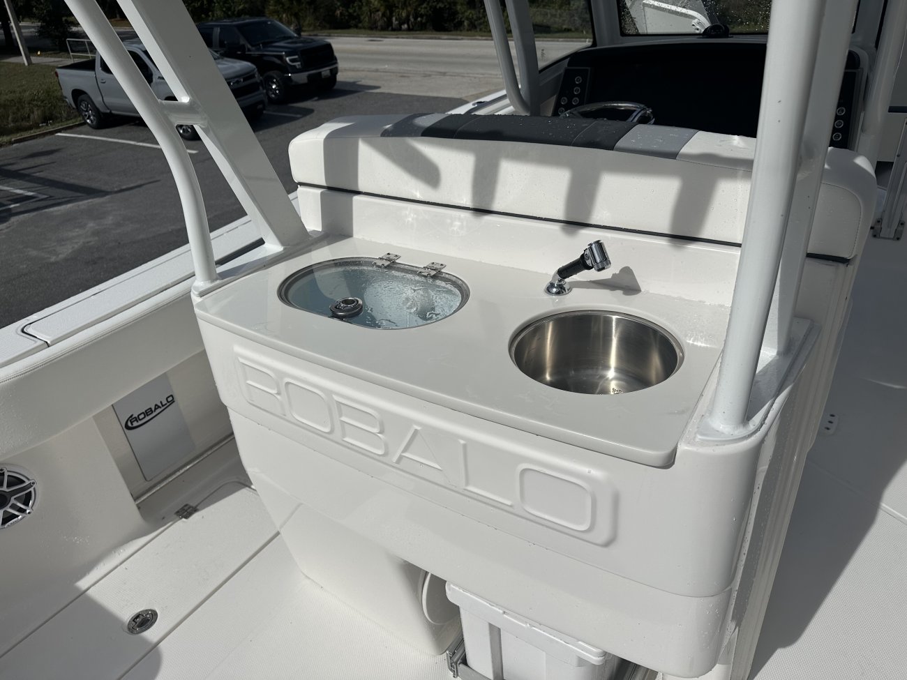 The definition of an outboard motor is a detachable engine mounted on outboard brackets on the stern of your boat.  This configuration will have triple engines.