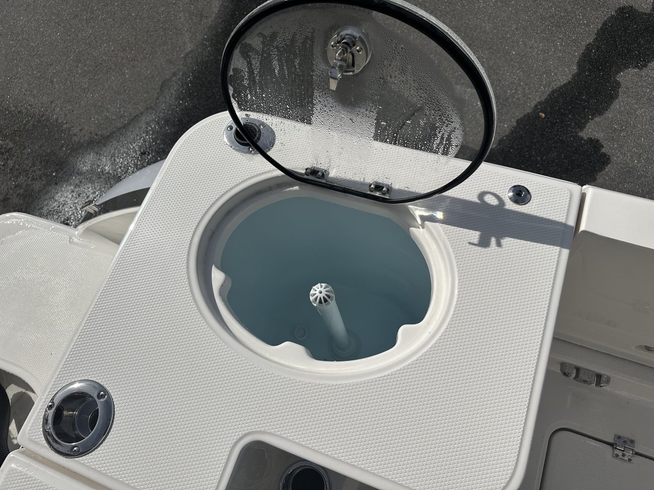 Glass fibers either loose or woven, reinforced with resin and used in the construction of many boats.