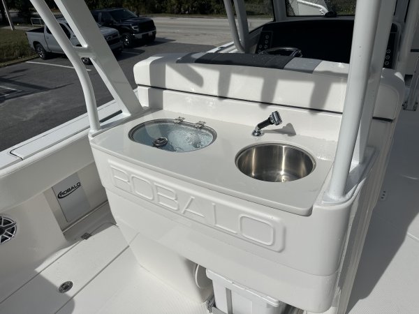 The definition of an outboard motor is a detachable engine mounted on outboard brackets on the stern of your boat.  This configuration will have triple engines.