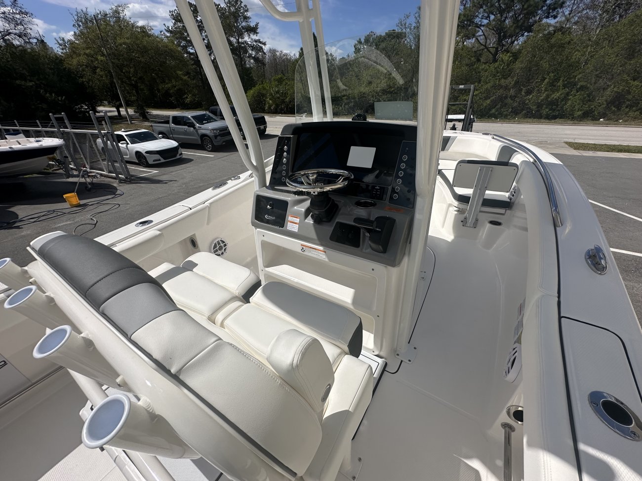 Glass fibers either loose or woven, reinforced with resin and used in the construction of many boats.