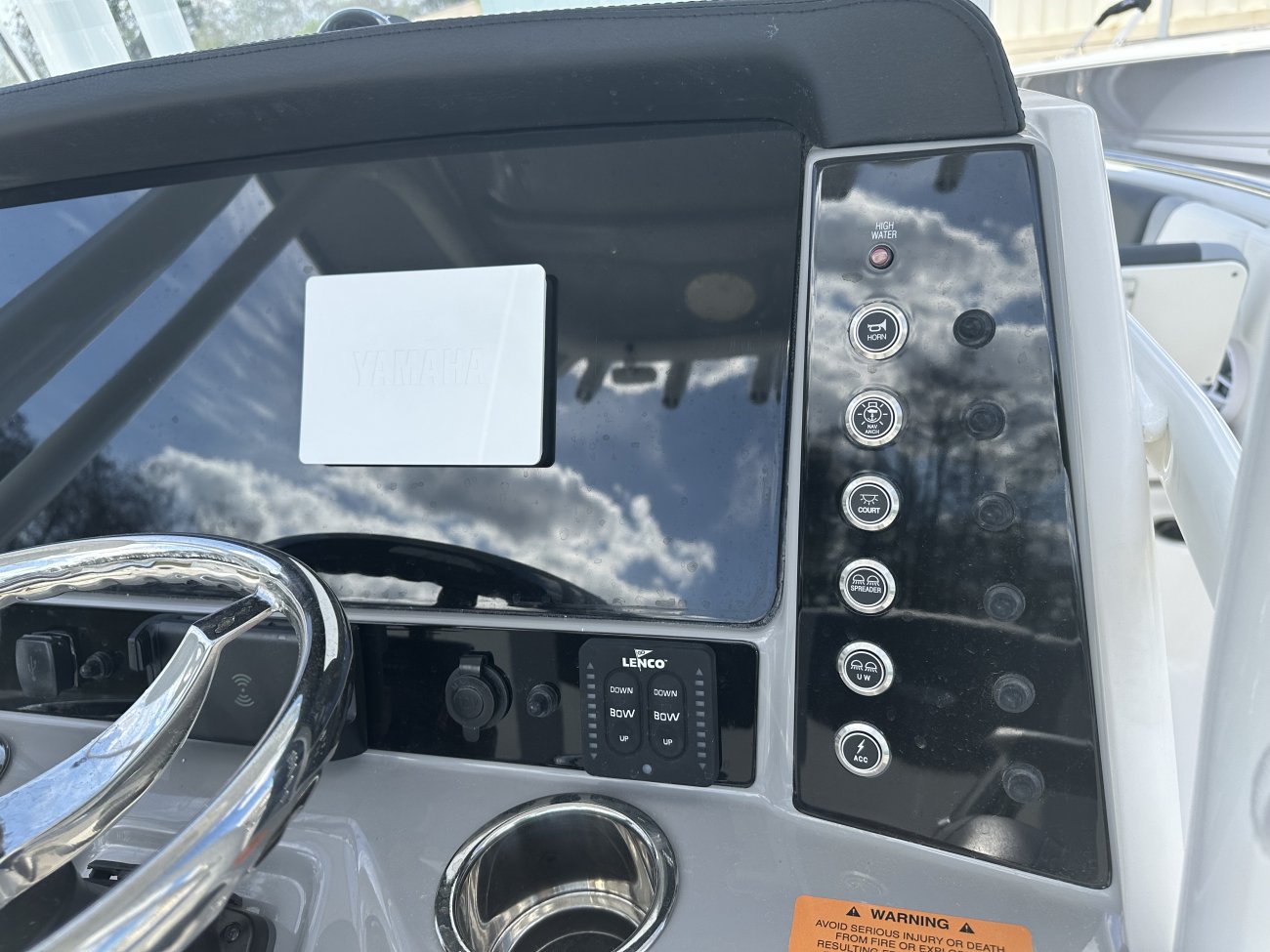 The definition of an outboard motor is a detachable engine mounted on outboard brackets on the stern of your boat.  This configuration will have only one single engine.