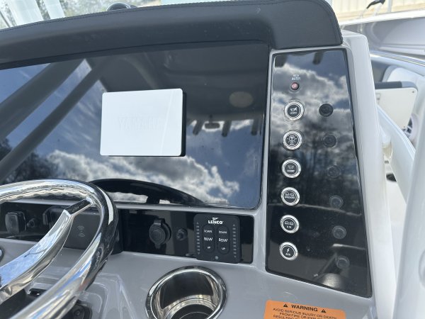 The definition of an outboard motor is a detachable engine mounted on outboard brackets on the stern of your boat.  This configuration will have only one single engine.