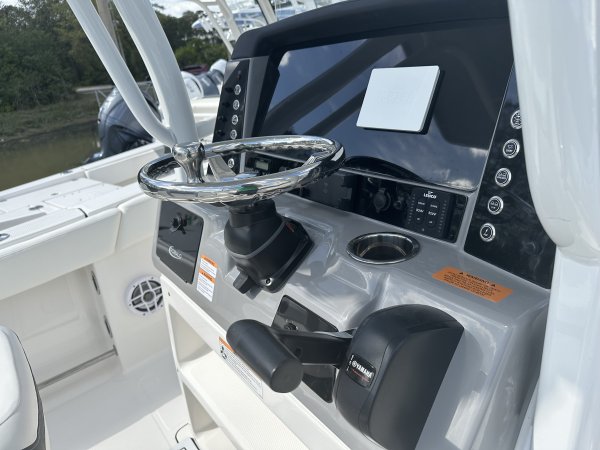 Center console is an open hull boat where the console of the boat is in the center. The boat deck surrounds the console so that a person can walk all around the boat from stern to bow with ease. Most center consoles are powered by outboard motors.
