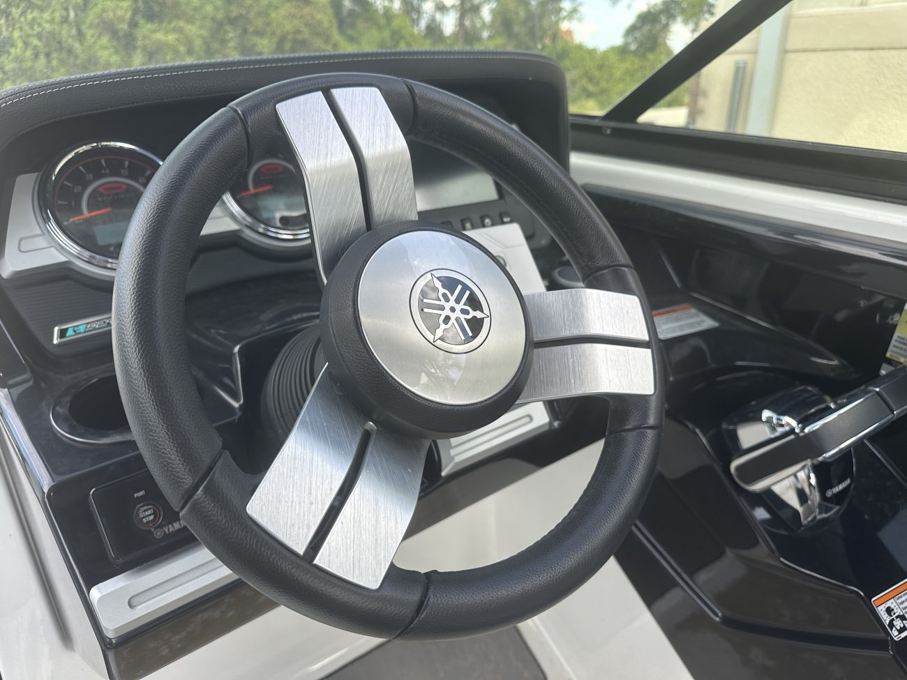 Glass fibers either loose or woven, reinforced with resin and used in the construction of many boats.