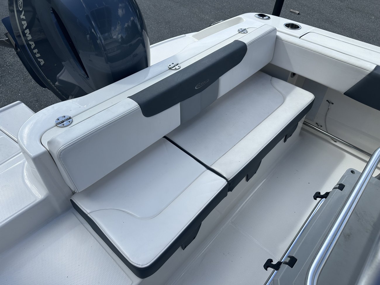 The definition of an outboard motor is a detachable engine mounted on outboard brackets on the stern of your boat.  This configuration will have only one single engine.