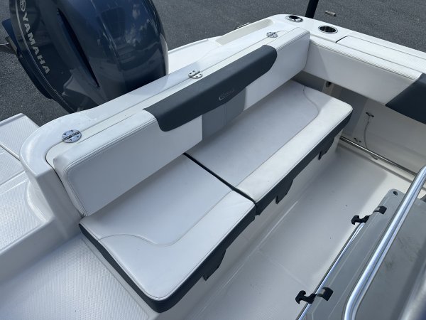 The definition of an outboard motor is a detachable engine mounted on outboard brackets on the stern of your boat.  This configuration will have only one single engine.